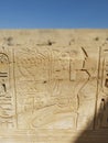 Wall at ancient Egyptian temple of Medinat Habu in Luxor Royalty Free Stock Photo