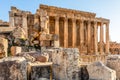 Columns of ancient Roman temple of Bacchus with surrounding ruins of ancient city, Bekaa Valley, Baalbek, Lebanon Royalty Free Stock Photo