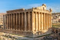 Columns of ancient Roman temple of Bacchus with surrounding ruins and blue sky in the background, Bekaa Valley, Baalbek, Lebanon