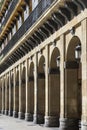Columns with arches in the facade of a medieval building Royalty Free Stock Photo