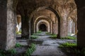 Columns and arches of an old abandoned building Royalty Free Stock Photo