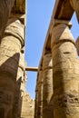 Columns of complex of Karnak temple with ancient egyptian hieroglyphs and symbols. Great Hypostyle Hall at Temples of Karnak Royalty Free Stock Photo
