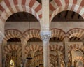 Columns and double-tiered arches of the Mosque-Cathedral of Cordoba in the Spanish region of Andalusia, Spain. Royalty Free Stock Photo