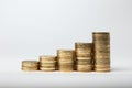 Columns of gold coins isolated on white background.