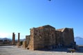 Columns on the hellenistic stoa of the Acropolis of Lindos, Rhodes, Greece, Blue sky, olive tree and beatiful sea view in the back Royalty Free Stock Photo