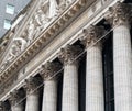 Columns and inscription under the bas-relief on the facade of the New York Stock Exchange on Wall Street Royalty Free Stock Photo