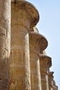 Columns of Karnak Temple complex with carved ancient Egyptian hieroglyphs and symbols. Great hypostyle hall in temples of Karnak Royalty Free Stock Photo