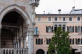 Udine - Columns of Loggia del Lionello with scenic view of facades of residential building