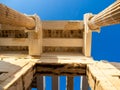 Columns of Propylaea gate entrance of Acropolis, Athens, Greece against blue sky