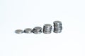 Columns of silver gold coins on a white background Royalty Free Stock Photo