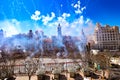 Columns of smoke from a mascleta, a typical daytime fireworks display during the Fallas of Valencia