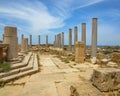 Columns against blue sky at ancient Roman ruins of Leptis Magna on the Mediterranean coast of Libya in North Africa Royalty Free Stock Photo