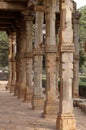 Columns with stone carving in courtyard of Quwwat-Ul-Islam mosque, Qutab Minar complex, Delhi Royalty Free Stock Photo