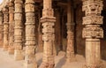 Columns with stone carving in courtyard of Quwwat-Ul-Islam mosque, Qutab Minar complex, Delhi Royalty Free Stock Photo