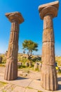 Columns of Temple of Athena and tourists in Assos ancient city