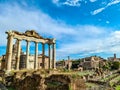 Rome - The columns of the Temple of Saturn and overview of the ancient ruins of the Roman Forum Royalty Free Stock Photo