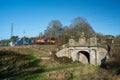 COLWICH, STAFFORDSHIRE, ENGLAND. JANUARY 2024. EWS locomotive travelling over a railway bridge on the West Coast mainline railway