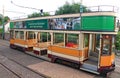 COLYTON, DEVON, ENGLAND - AUGUST 6TH 2012: An orange and green tram sits empty in Colyford station on the Seaton tramway