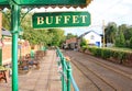 COLYTON, DEVON, ENGLAND - AUGUST 6TH 2012: The station buffet sign and empty tracks at Colyford station on the Seaton tramway