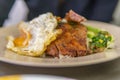 Vietnamese broken rice with grilled pork chop, fried egg and meatloaf Royalty Free Stock Photo