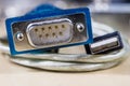 COM and USB plugs on a wooden workshop table. Telecommunications Royalty Free Stock Photo