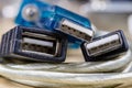 COM and USB plugs on a wooden workshop table. Telecommunications Royalty Free Stock Photo