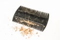 Comb brush with lost hair and dandruff - baldness concept Royalty Free Stock Photo