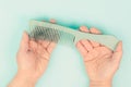 Comb with hair loss, health problem, issue of aging, alopecia areata by stress or infection, hairbrush