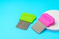 Comb for lice removing on blue background Royalty Free Stock Photo