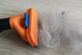 The comb of pet slicker brush with cat fur clump after grooming Royalty Free Stock Photo