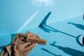 Comb on towel and shadows on blue background, zero waste concept. Royalty Free Stock Photo