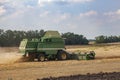 Combain harvester mows wheat