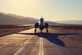 Combat Aircraft Positioned for Takeoff in Arid Landscape.