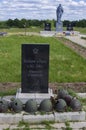 Combat helmets and a monument to the Soviet soldier