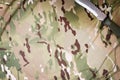 Combat knife on military camouflage fabric background Royalty Free Stock Photo