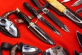 Combat knives on a red background. Arms trade in the store. View from above