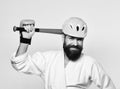 Combat master gets ready to fight. Karate man with smile Royalty Free Stock Photo