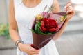 Combination of colorful flowers in woman hands Royalty Free Stock Photo