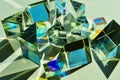 A combination of dichroic glass cube and triangular prism spreading sunlight.