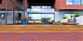 Combination of different finishes. Wooden steps to the patio near the exit to the backyard. Red brick pavement. Comfortable