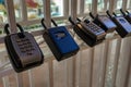 Combination key lockboxes mounted on white railing Royalty Free Stock Photo