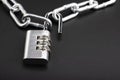 Combination key unlocked and metal chain on black background , Security and safety concept Royalty Free Stock Photo