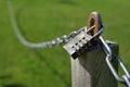 Combination lock secures a chain attached to a wooden post Royalty Free Stock Photo
