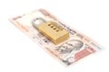 Combination padlock on Indian currency rupee Royalty Free Stock Photo