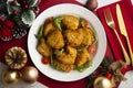 Combination plate with chicken, persimmon salad and rice. Top view table with christmas decorations. Royalty Free Stock Photo