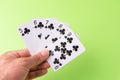 The combination of playing cards poker casino. Isolated on green background