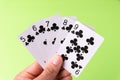 The combination of playing cards poker casino. Isolated on green background