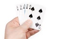 Combination of playing cards of spades suit in male hand Royalty Free Stock Photo