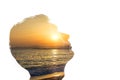 Combination of the silhouette of a man face and a seascape with a sunset. Concept of unity of nature and people