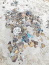 A combination of small and large rocks with sand particles on the sea shore Royalty Free Stock Photo